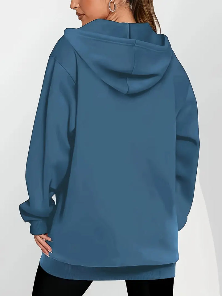 Angeleen – Bunda s kapucí, zipem a geometrickým potiskem.