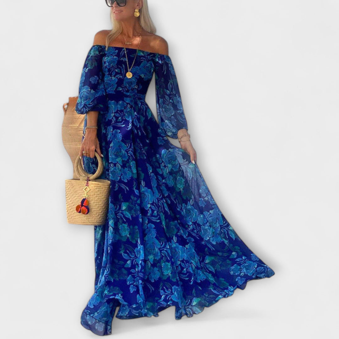 Brigita - Dlouhé šaty s květinovým potiskem a odhalenými rameny.